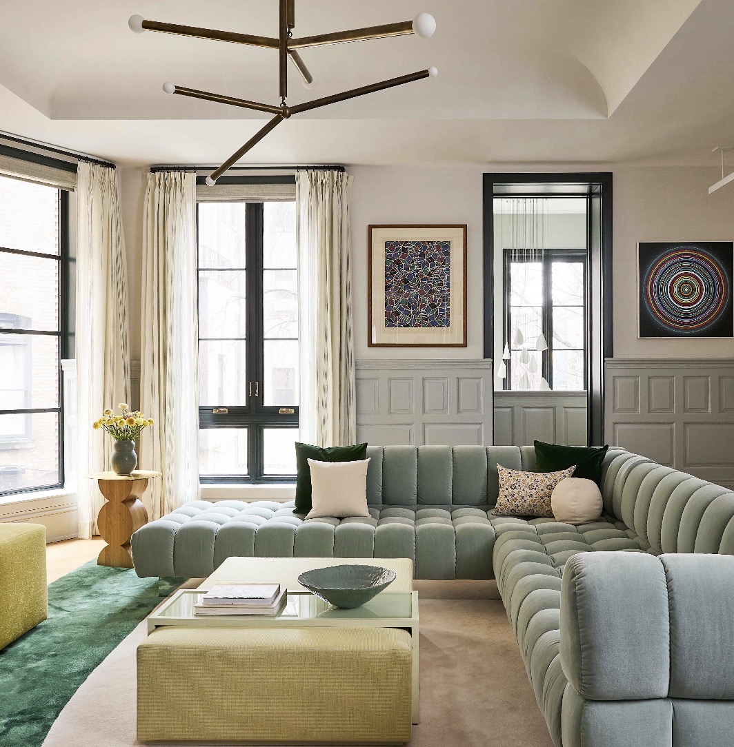 Bright modern living room with green sectional sofa